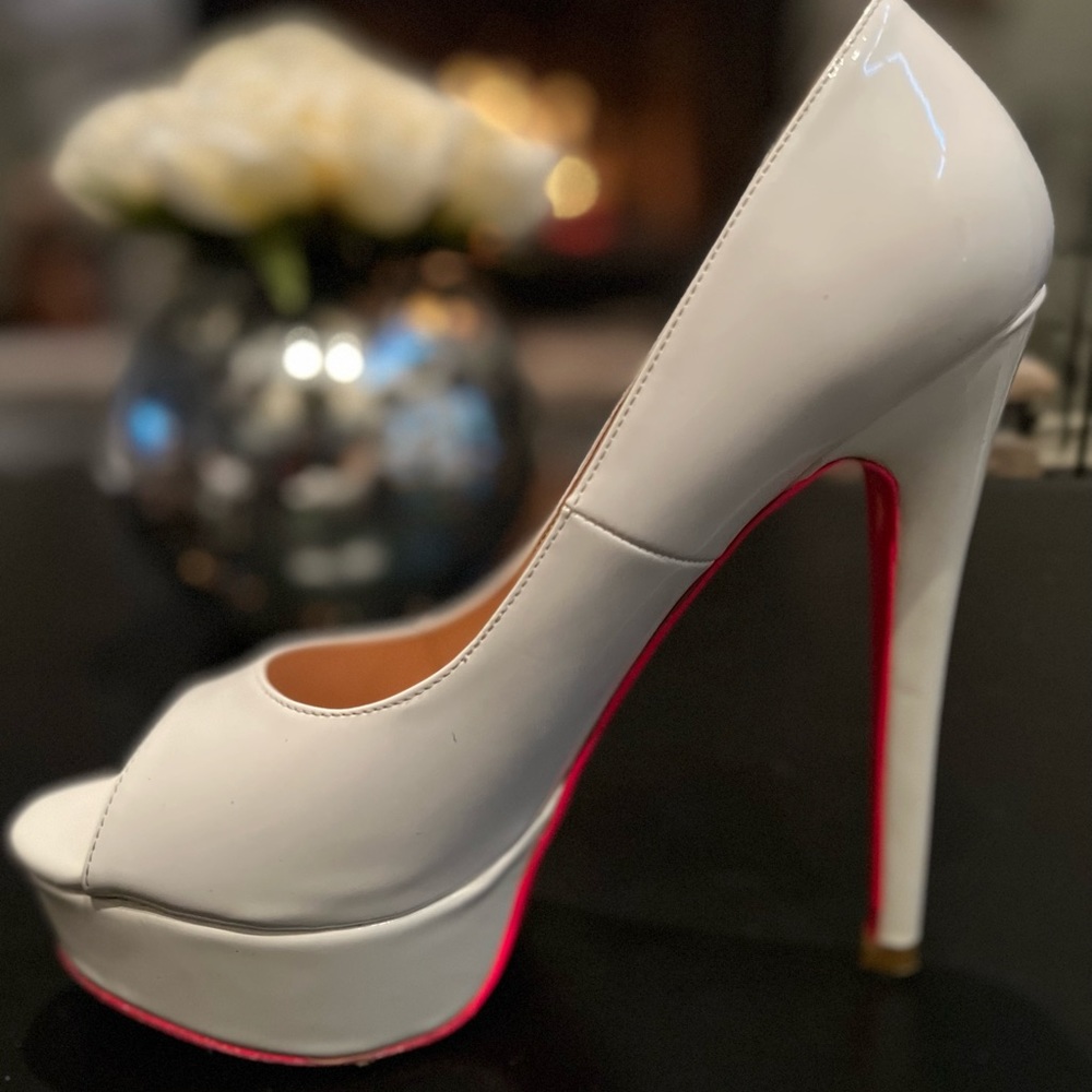White platform heels with hot pink bottoms